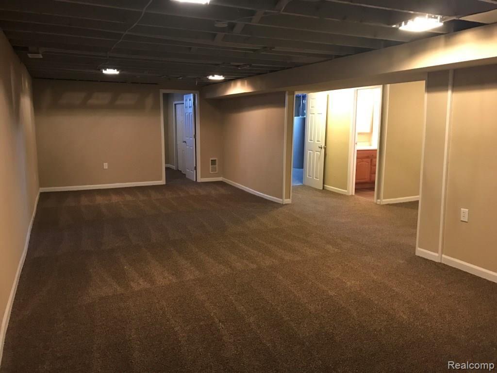 8651 Pingree Road Pinckney, MI 48169 - Photo 19 of 33 Huge rec room space in the basement