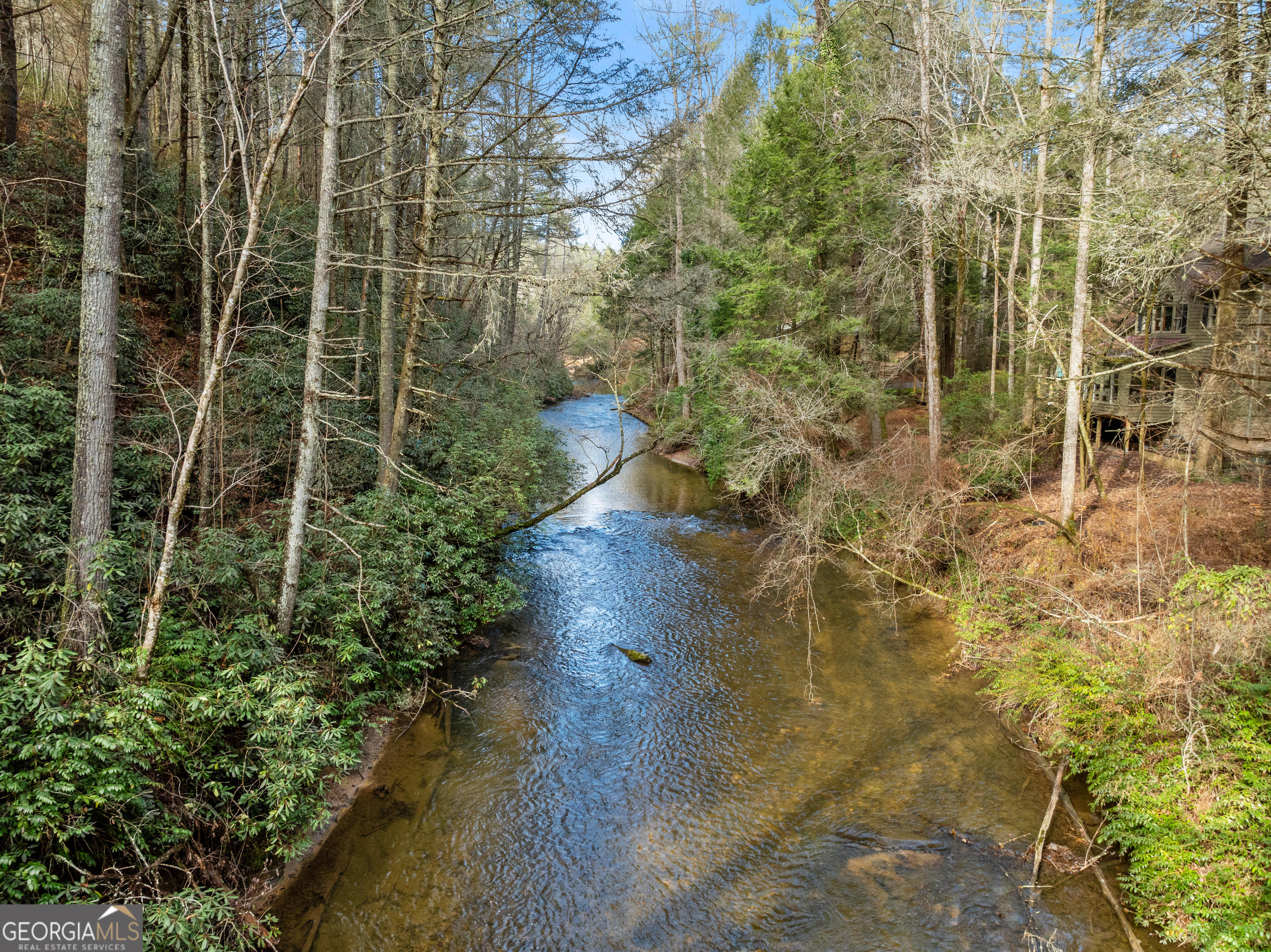 21 Soque Wilderness Road Clarkesville, GA 30523 - Photo 6 of 15 a view of a pathway of a brick building
