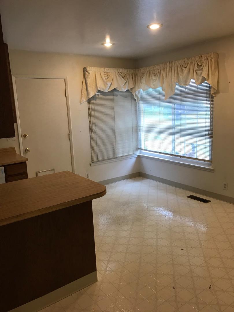 1273 Aspen Drive Pacifica, CA 94044 - Photo 5 of 12 a view of a room with gym equipment and windows