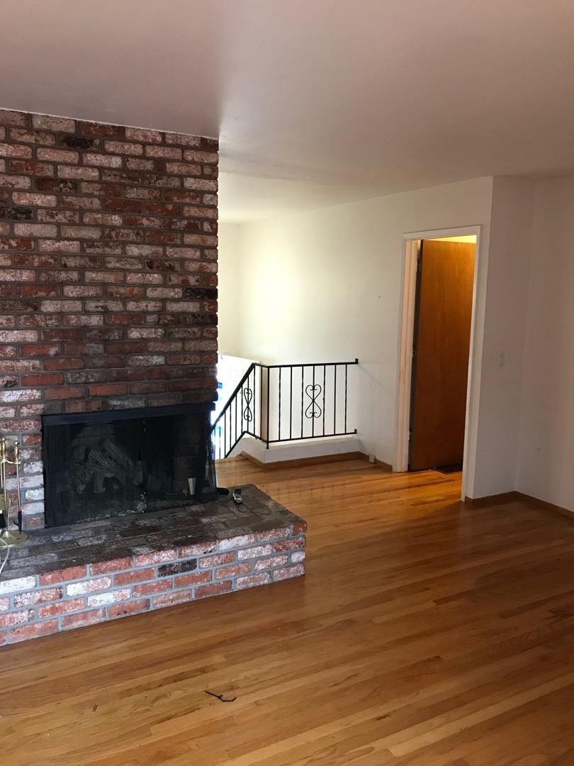 1273 Aspen Drive Pacifica, CA 94044 - Photo 8 of 12 a view of fireplace with wooden floor