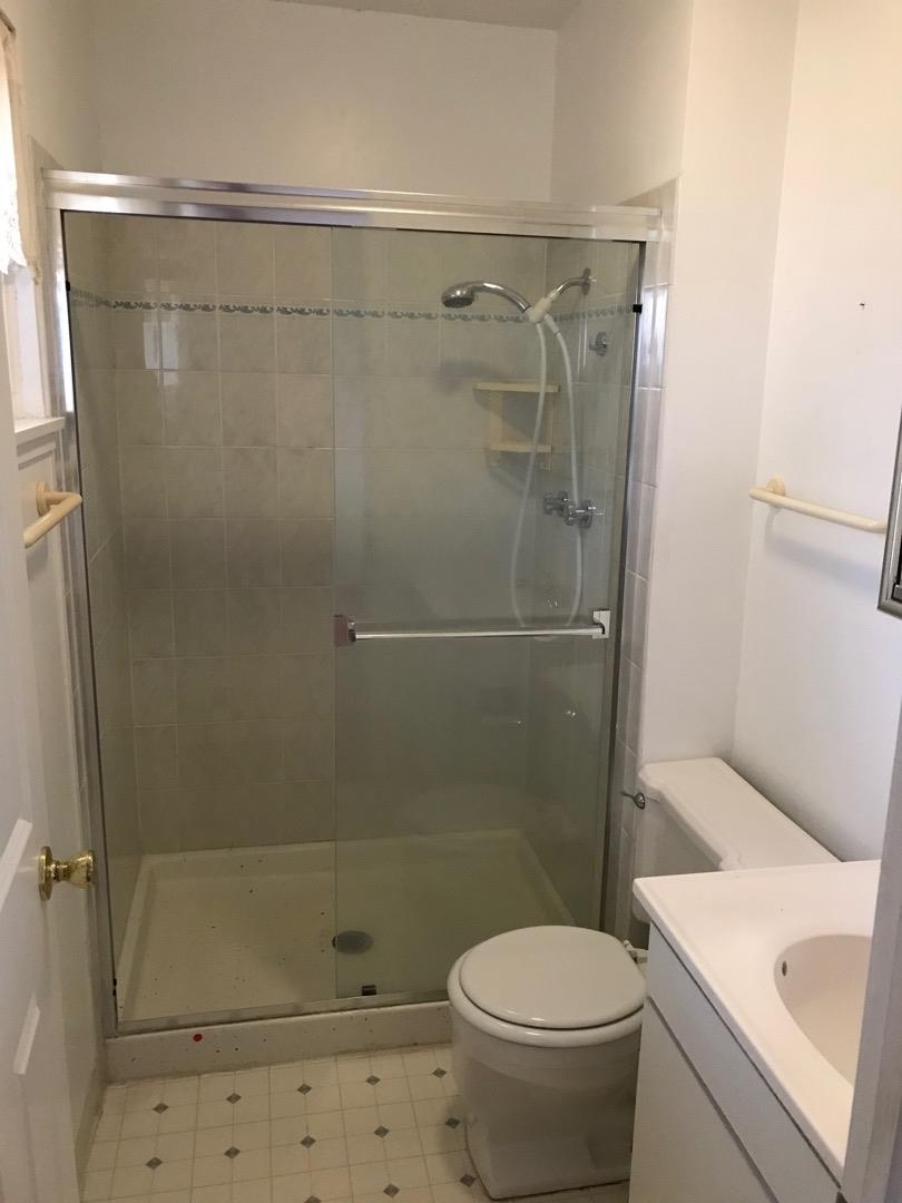 1273 Aspen Drive Pacifica, CA 94044 - Photo 9 of 12 a bathroom with a shower and a toilet