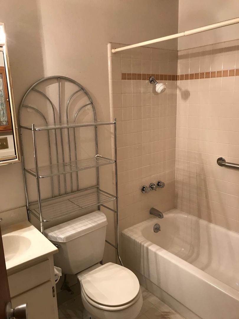1273 Aspen Drive Pacifica, CA 94044 - Photo 10 of 12 a bathroom with a toilet a sink and bathtub