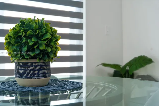 a vase of flowers sitting on a table