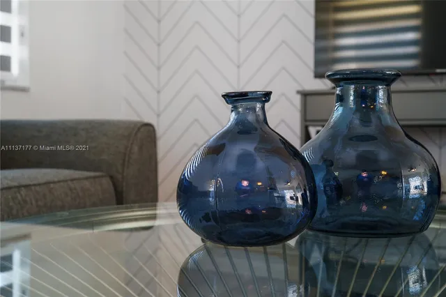 a bedroom with a bed and a table