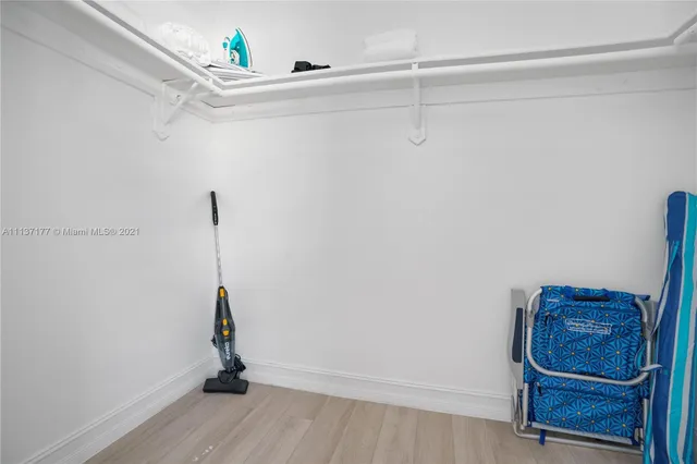 a bedroom with a bed and a lamp on table