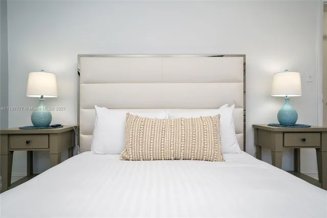 a bedroom with a bed and furniture