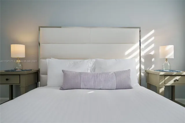 a bathroom with a sink toilet and a mirror