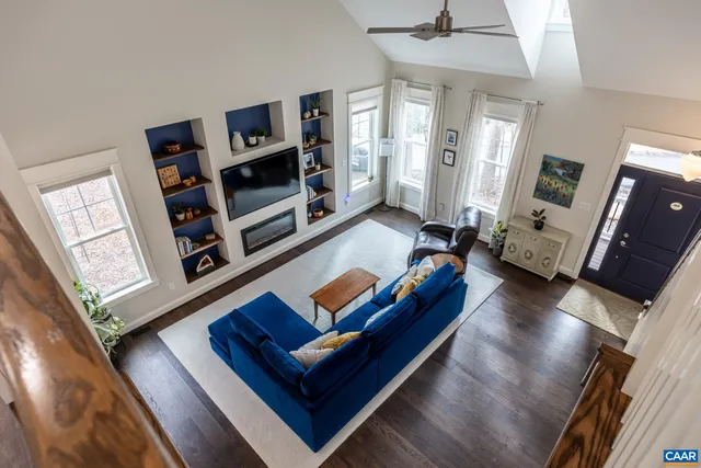 a view of a yard with wooden fence