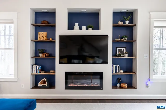 a large kitchen with kitchen island a stove a sink a dining table and chairs