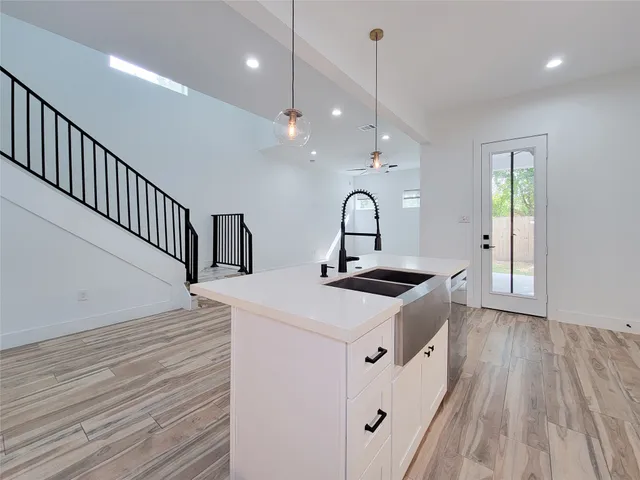 a view of kitchen and wooden floor