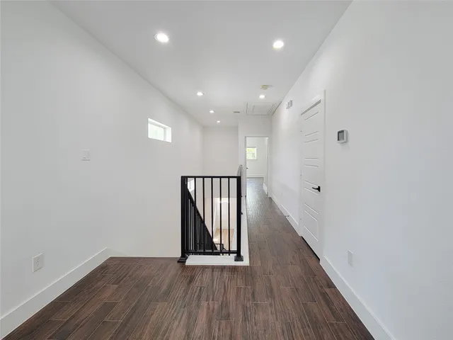 a view of a balcony with wooden floor