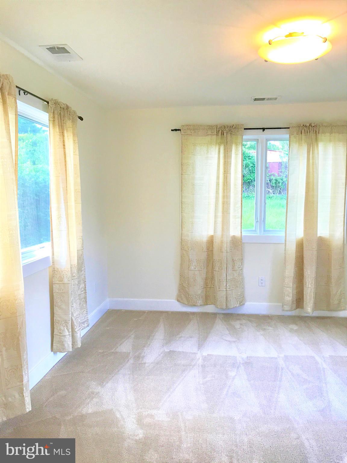 2419 Darrow Street Silver Spring, MD 20902 - Photo 26 of 33 a view of an empty room with a window