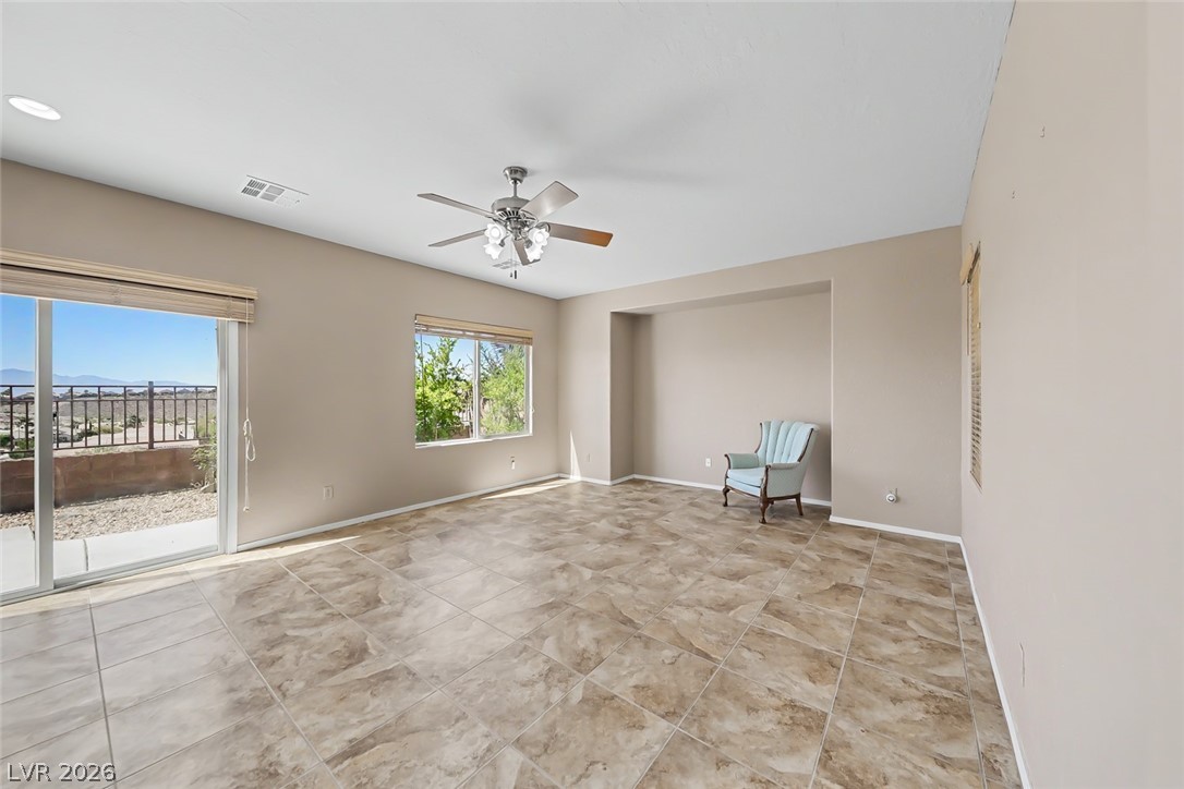 2356 Rue Bienville Way Henderson, NV 89044 - Photo 4 of 20 This airy room offers expansive views and versatile living space, perfect for relaxation or entertaining.