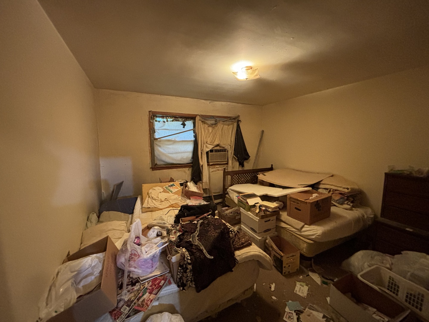 3440 Green Street Steger, IL 60475 - Photo 5 of 9 a bed sitting in a room next to a window