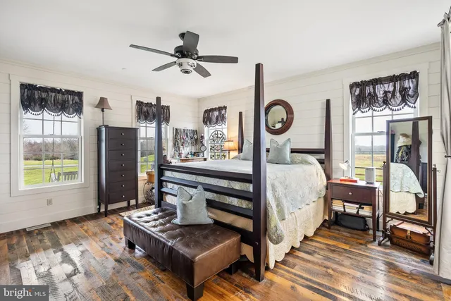 a view of a two chairs in the balcony