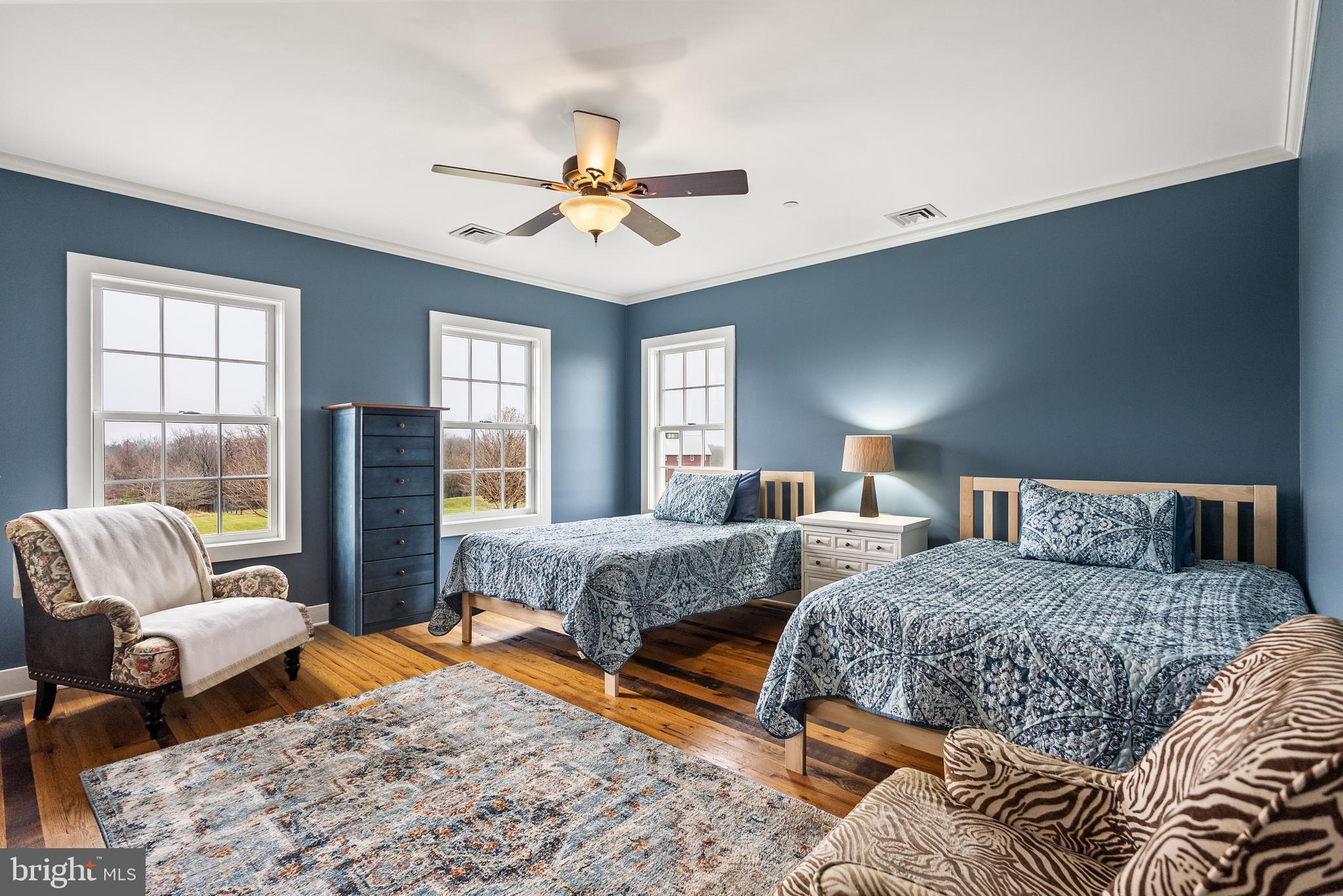 21100 West Offutt Road Poolesville, MD 20837 - Photo 22 of 58 a bedroom with two beds and a large window
