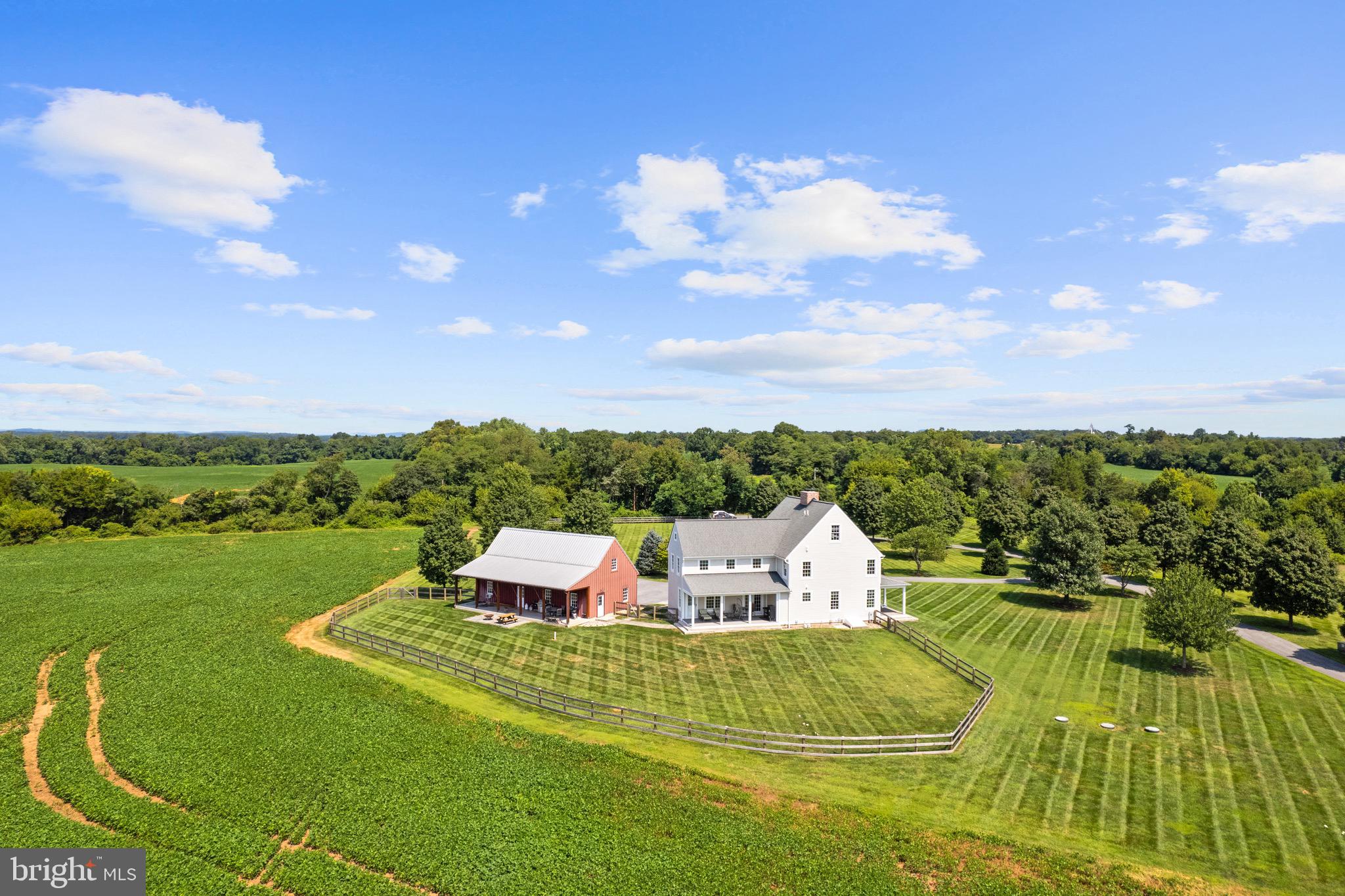 21100 West Offutt Road Poolesville, MD 20837 - Photo 52 of 58 a front view of a house with a garden