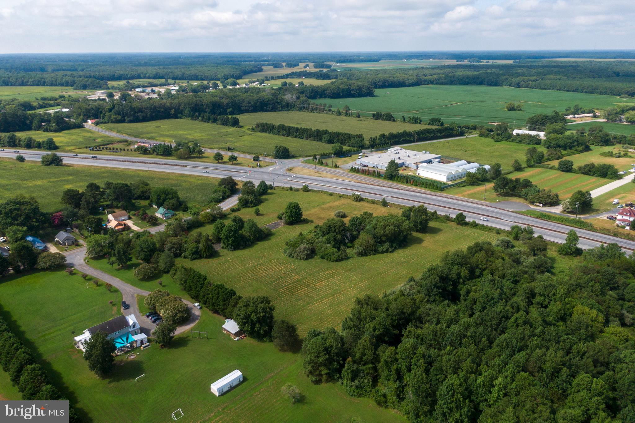 Cove Landing Road Bishopville, MD 21813 - Photo 8 of 12 an aerial view of a city with lots of residential buildings and mountain view in back