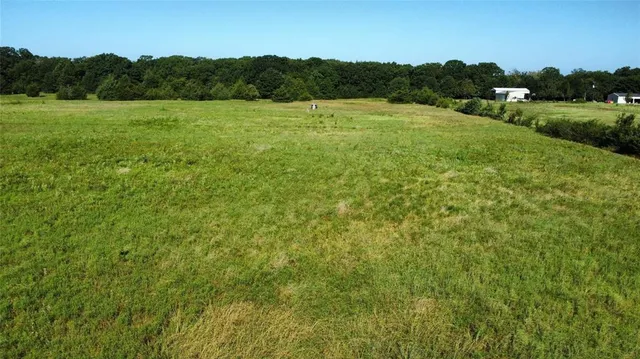 a view of a lake with a yard