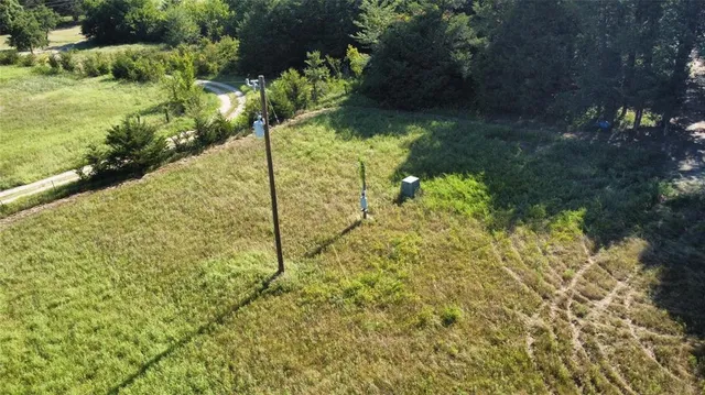 a backyard of a house with a yard and outdoor seating