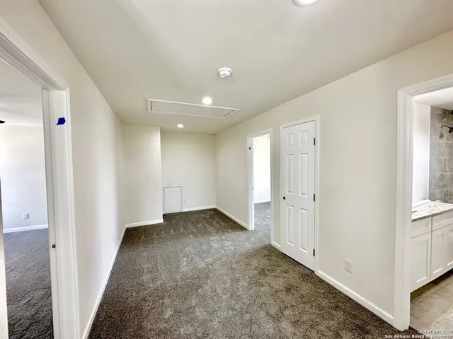 a view of a hallway with closet area