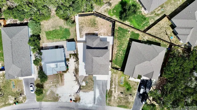 an aerial view of houses with outdoor space