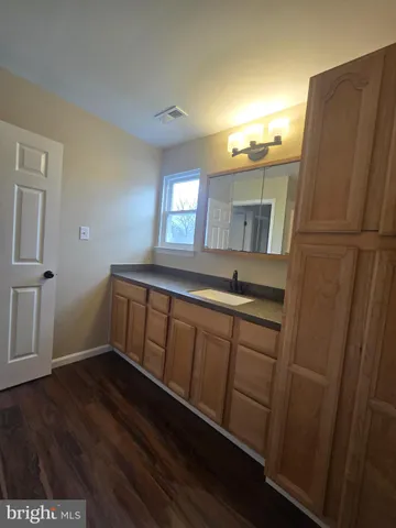 a view of kitchen with wooden floor