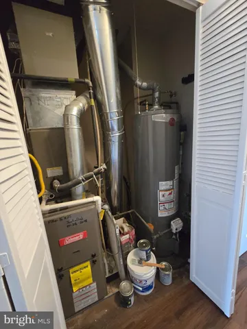 a view of hallway with wooden floor