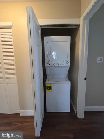 a bathroom with a toilet and a mirror