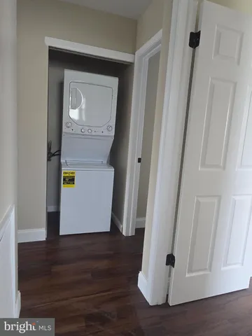 a view of an entryway with wooden floor