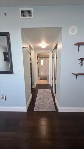 a bathroom with a double vanity sink a mirror a shower and a bathtub