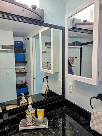 a kitchen with stainless steel appliances granite countertop a stove a refrigerator and a sink