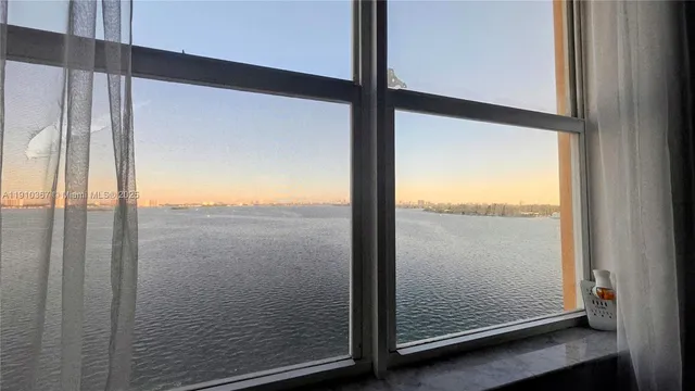 a kitchen with stainless steel appliances granite countertop a sink and refrigerator