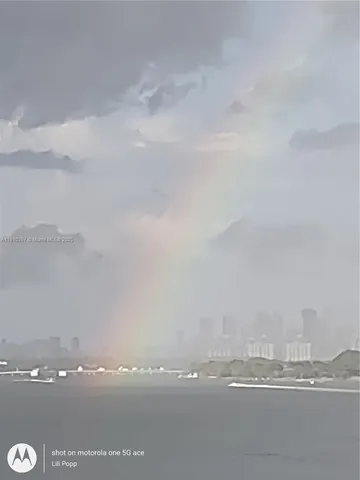 a kitchen with stainless steel appliances granite countertop a refrigerator a stove and a sink with granite countertops