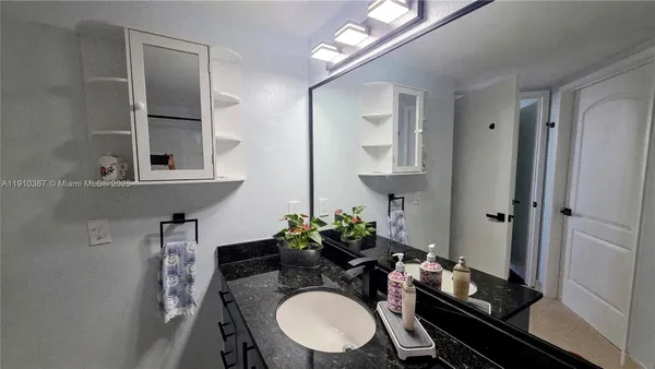 an ocean view with palm trees