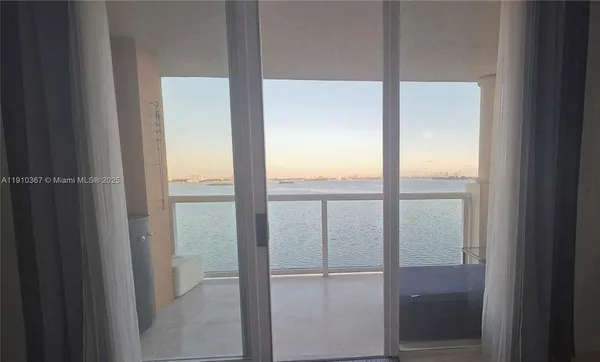 a view of a livingroom with wooden floor