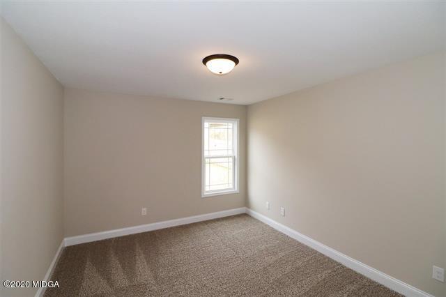 116 Hawks Ridge Byron, GA 31008 - Photo 22 of 34 an empty room with windows and closet