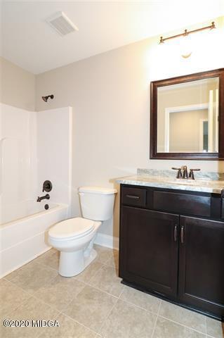 116 Hawks Ridge Byron, GA 31008 - Photo 24 of 34 a bathroom with a sink toilet and mirror