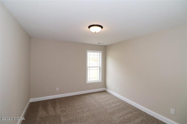 116 Hawks Ridge Byron, GA 31008 - Photo 25 of 34 an empty room with windows and closet