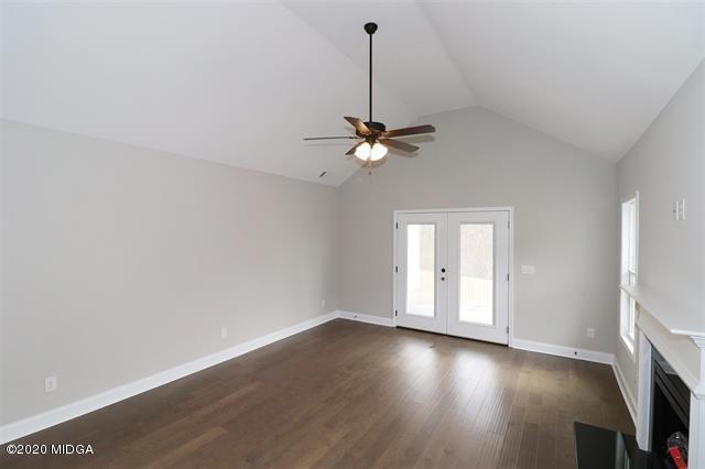 116 Hawks Ridge Byron, GA 31008 - Photo 6 of 34 wooden floor in an empty room with a window