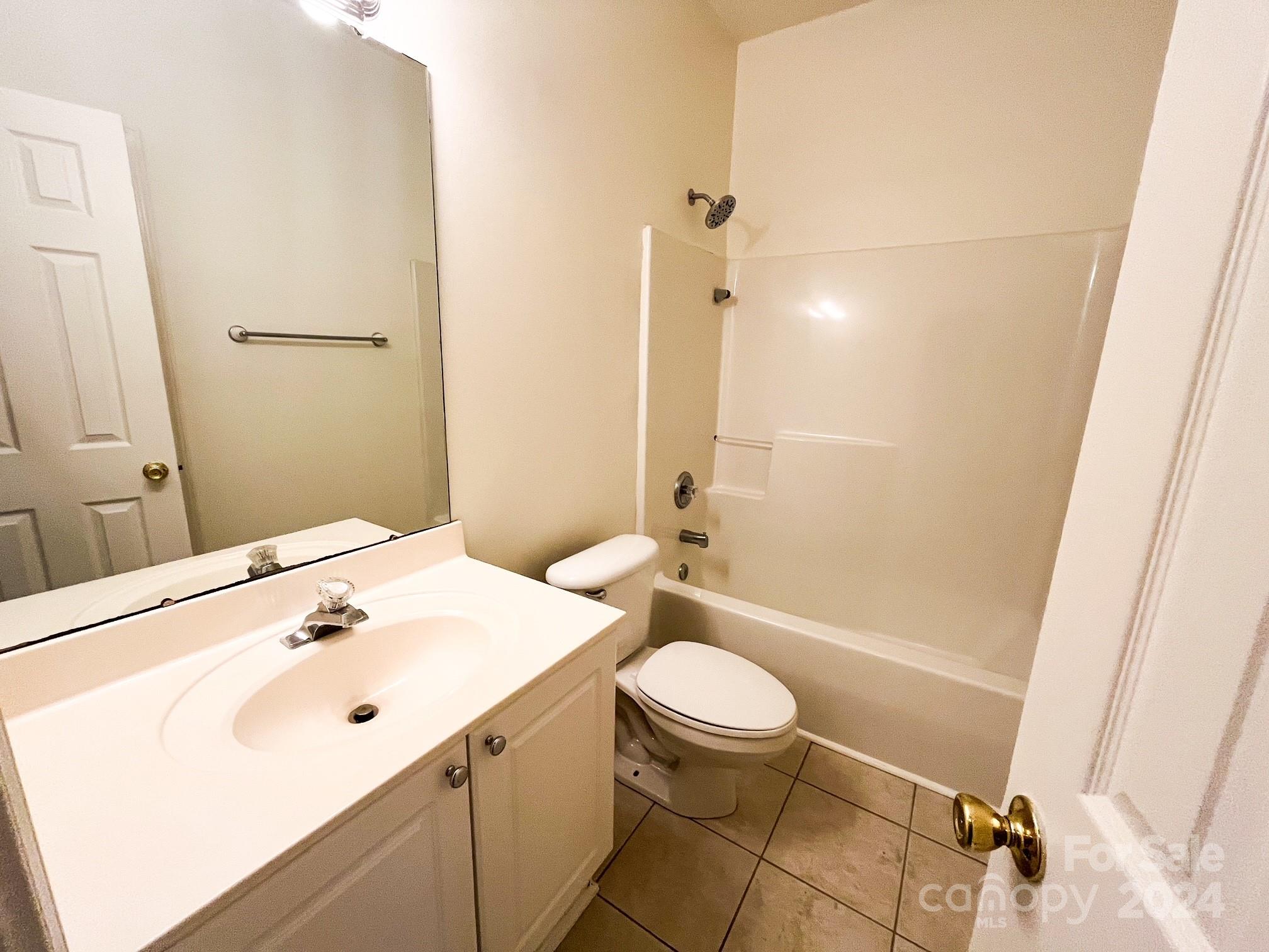 3079 River Ridge Drive Gastonia, NC 28056 - Photo 12 of 24 a bathroom with a sink a toilet and shower