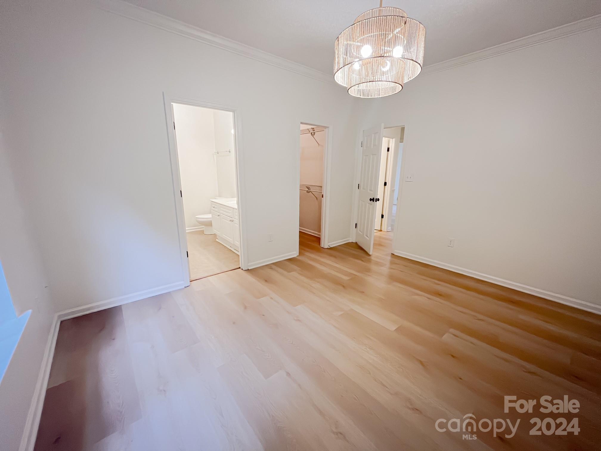 3079 River Ridge Drive Gastonia, NC 28056 - Photo 14 of 24 a view of an empty room with a chandelier fan