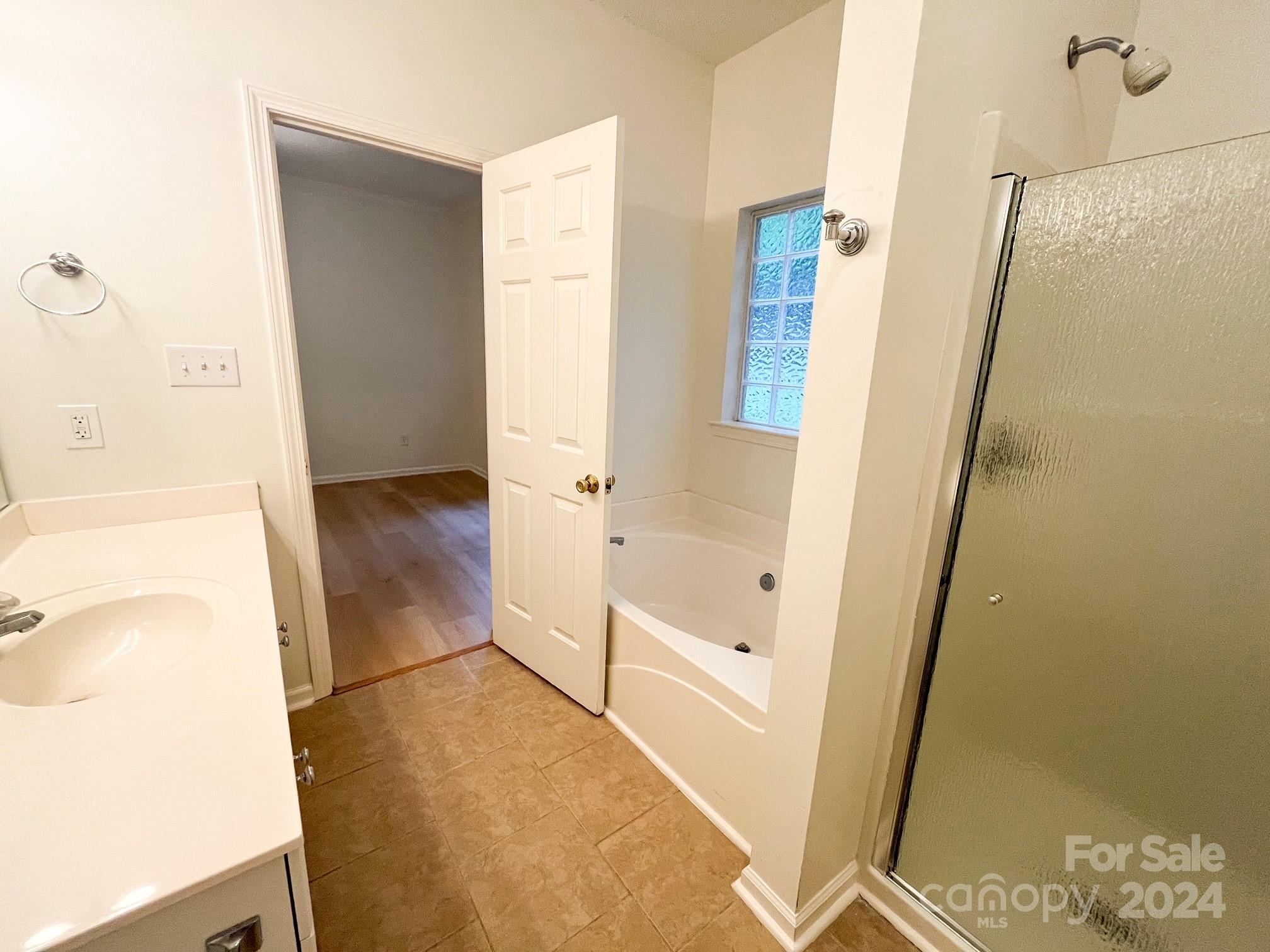 3079 River Ridge Drive Gastonia, NC 28056 - Photo 16 of 24 a bathroom with a tub and a shower