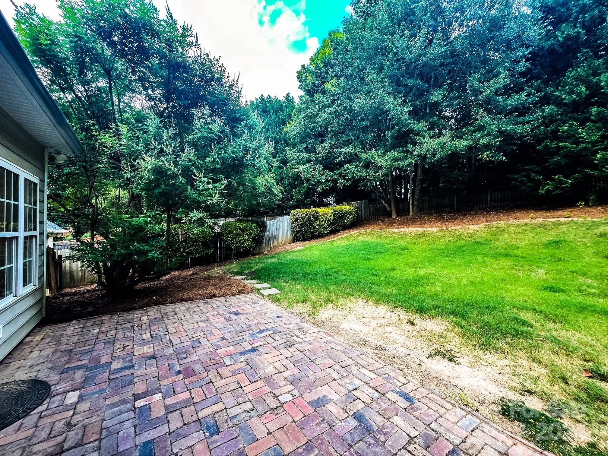 3079 River Ridge Drive Gastonia, NC 28056 - Photo 20 of 24 a view of a backyard with a garden