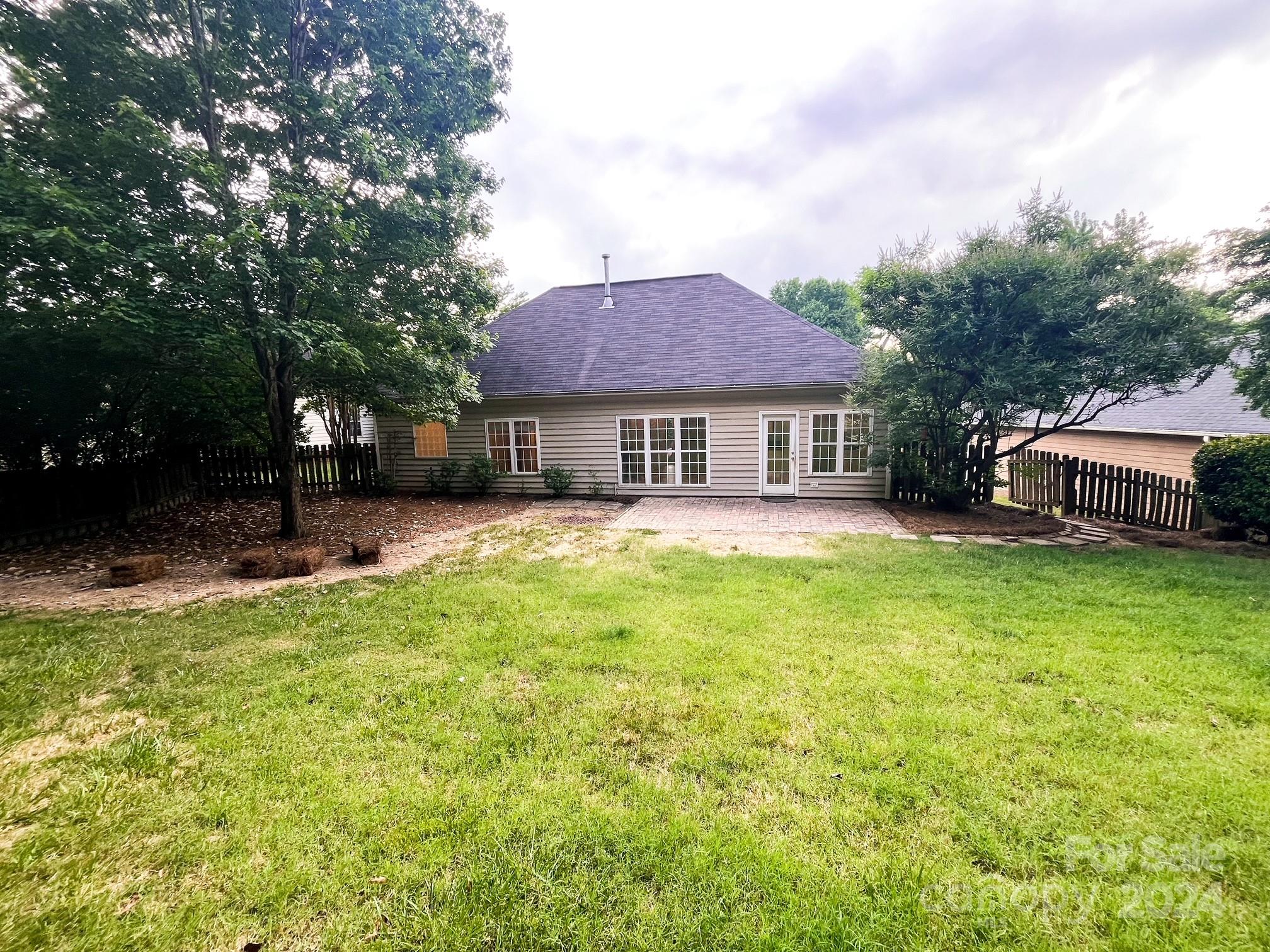 3079 River Ridge Drive Gastonia, NC 28056 - Photo 21 of 24 a view of a house with a big yard and large trees