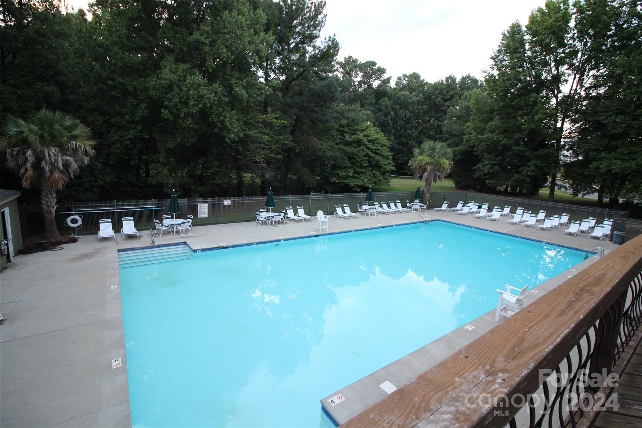 3079 River Ridge Drive Gastonia, NC 28056 - Photo 23 of 24 a view of a swimming pool with chairs