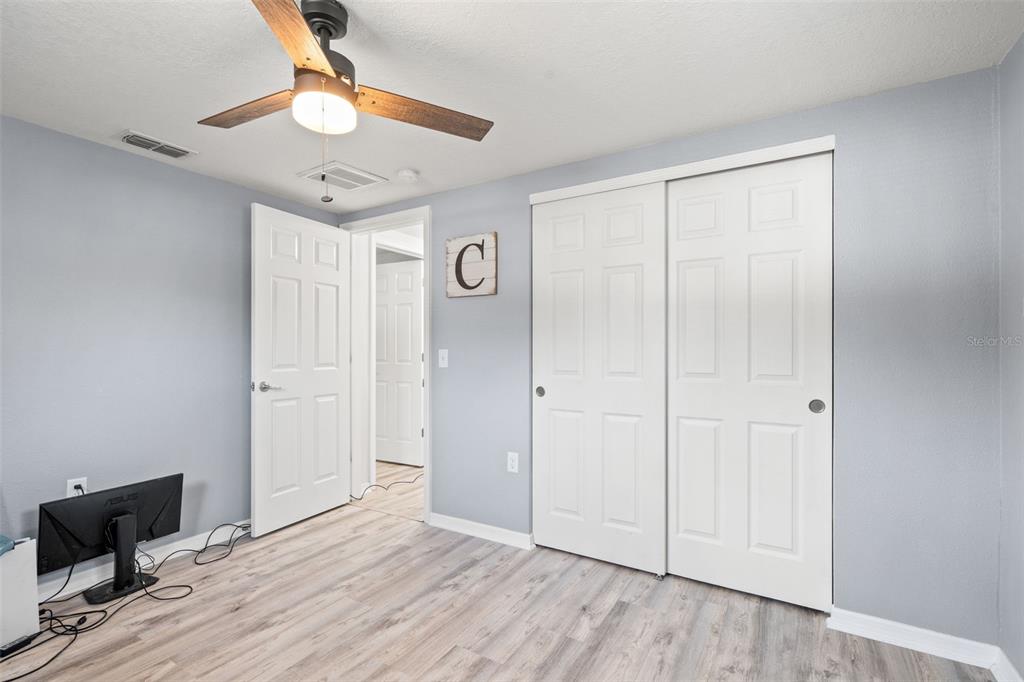 3709 Panola Drive New Port Richey, FL 34652 - Photo 12 of 36 wooden floor in an empty room with a window