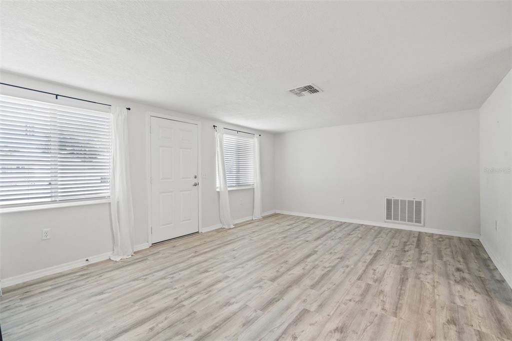 3709 Panola Drive New Port Richey, FL 34652 - Photo 18 of 36 wooden floor in an empty room