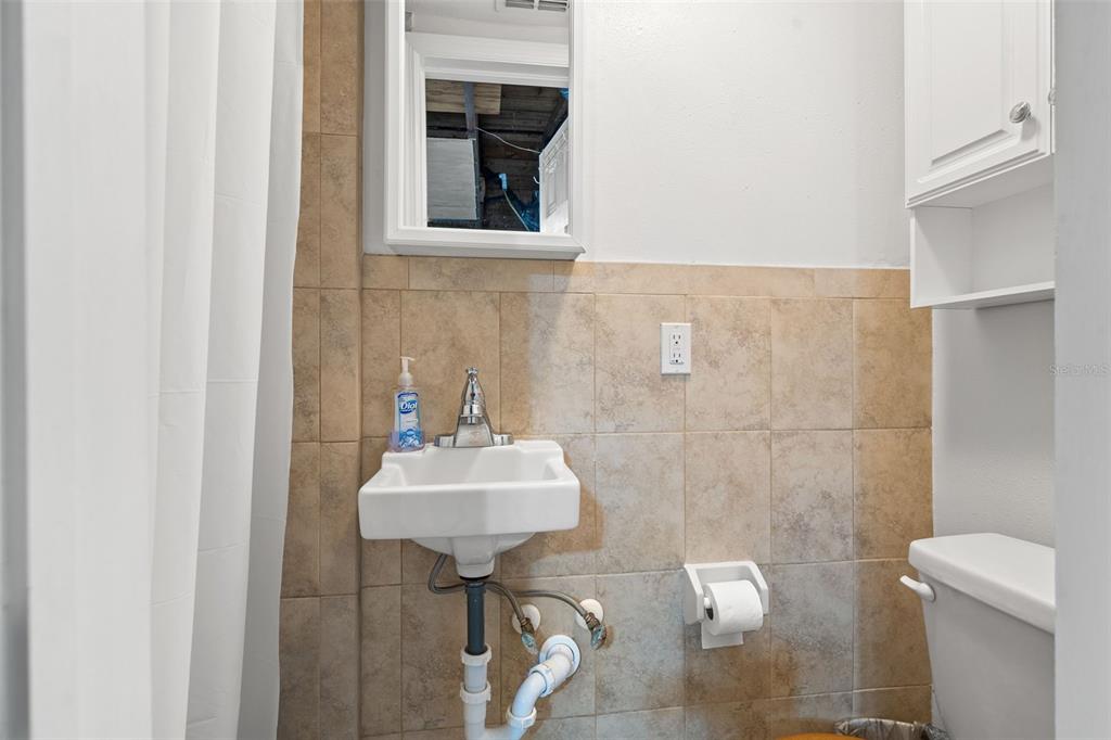 3709 Panola Drive New Port Richey, FL 34652 - Photo 20 of 36 a bathroom with a sink and mirror