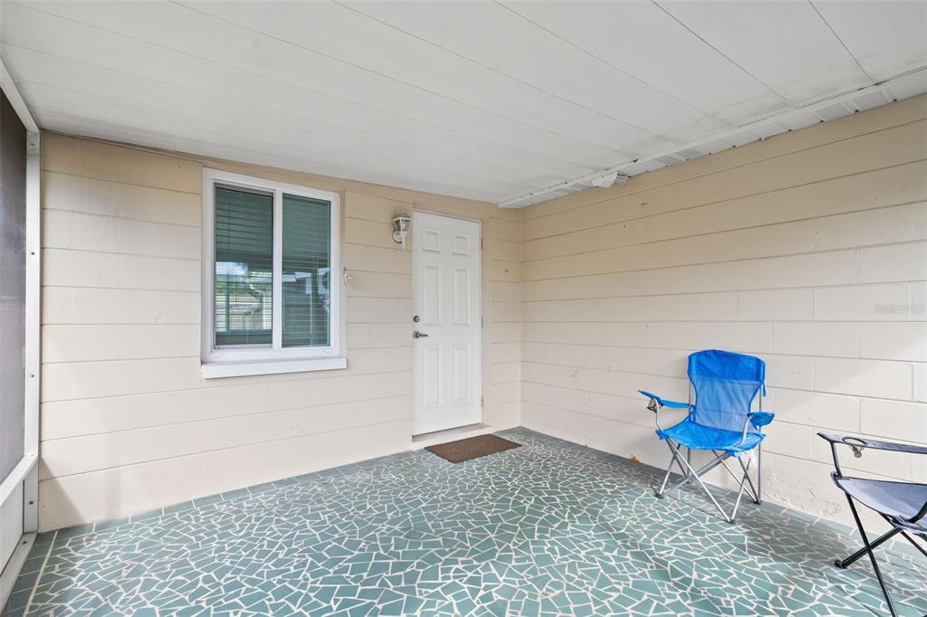 3709 Panola Drive New Port Richey, FL 34652 - Photo 24 of 36 a room that has a rug and a chair in it